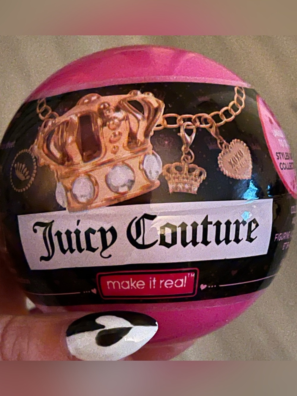 Juicy Couture unopened Surprise ball with collectible inside.